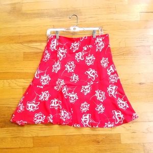 Loft orange swing skirt.